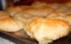 A baking sheet full of homemade bagels