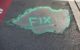 Pothole with the word "FIX" spray painted on top (photo by Deborah Fitchett via Flickr/Creative Commons https://flic.kr/p/7EyMVT)