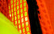 Close up on a safety vest with day glo yellow and orange colors. (Photo by swirlingthoughts via Flickr/Creative Commons https://flic.kr/p/d5u74)