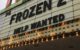 Movie marquee reads: "FROZEN 2 HELP WANTED"