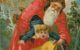 A close-up of an illustrated Christmas postcard showing Santa Claus putting a frightened child into a sack. The caption reads "A Happy Christmas." Image via Wikicommons https://commons.wikimedia.org/wiki/File:Christmas_postcard_with_illustration_of_Santa_Claus_attempting_to_insert_frightened_child_into_sack,_with_%22A_Happy_Christmas%22.jpg