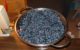 A colander full of blueberries