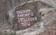 Words painted on rock read "CHICKEN FARMER I STILL LOVE YOU" (photo by Mary Ellen Carter via Flickr/Creative Commons)