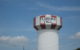 Water tower with red and white vertical stripes and the words "Florence Y'all" painted in black block letters. Photo by madaise via Flickr/Creative Commons https://flic.kr/p/5kyS3h