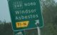 Road sign in Quebec points to the towns of Windsor and Asbestos. (Photo by hotdogPi via Flickr/Creative Commons https://flic.kr/p/2gwVLne)