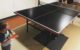 Two year old and one year old play table tennis