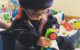 Two year old playing with bristle blocks