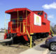 A red caboose with the McDonald's "golden arches" logo on the side. (Photo by Patrick Feller via Flickr/Creative Commons https://flic.kr/p/7Jqn6R)