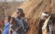 A Maasai man talks on his phone during a community gathering. Timothy D. Baird/Virginia Tech, CC BY-ND