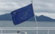 Alaska's flag flies off the side of a ship. (Photo by Kim F via Flickr/Creative Commons https://flic.kr/p/7EV3rs)