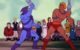 He-Man and Skeletor are sword fighting, while a bunch of Eternians watch