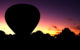 The silhouette of a hot air balloon in front of a sunset - this is not the balloon from the escape flight out of East Germany. (Photo by David Atkinson via Flickr/Creative Commons https://flic.kr/p/6aUU99)