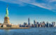 Statue of Liberty in the foreground, the Manhattan skyline in the background. (Photo by Pierre Blaché via Flickr/Creative Commons https://flic.kr/p/2id3eF4)