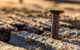 Two rusty nails sticking up and out of some old wood. (Photo by Sheila Sund via Flickr/Creative Commons https://flic.kr/p/M27GSk)