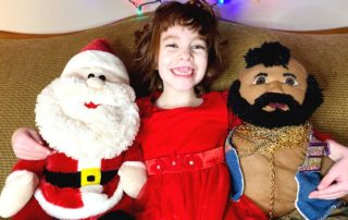 Five year old with Santa and Mr. T