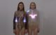 Screenshot from Emotional Clothing Collection video. It shows two women wearing clothes that have lights embedded in them.