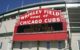 The big red sign that says "Wrigley Field - Home of Chicago Cubs" (Photo by Jordan via Flickr/Creative Commons https://flic.kr/p/ndg47)