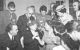 Helen Keller, surrounded by journalists, communicates with her helper Polly Thomson. On the left is Conrad Bonnevie-Svendsen, the Norwegian Chairman of the Rotary International Convention Committee. (Photo by Wikicommons https://commons.wikimedia.org/wiki/Category:Helen_Keller_in_1950#/media/File:Keller,_Thomson,_Bonnevie-Svendsen.jpg)