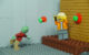 A Lego zombie throws Lego tomatoes at a scared Lego standup comedian. (Photo by BRICK 101 via Flickr/Creative Commons https://flic.kr/p/FRwXac)