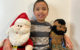 The nearly eight year old with Santa and Mr. T