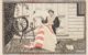 Woven picture of a seated Betsy Ross sewing the first American flag was made for the Louisiana Purchase Exposition or as it was commonly known, the St. Louis World’s Fair of 1904. Betsy Ross sits with the flag on the front porch of a clapboard house with a spinning wheel and cat. American Textile History Museum Collection via Creative Commons https://www.si.edu/object/picture:chndm_2016-35-75