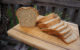 A loaf of sliced bread on a wooden cutting board. (Photo by Bart Everson via Flickr/Creative Commons https://flic.kr/p/dErQ3a)