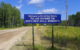 A blue sign reads, "Welcome to the United States - You are entering the North West Angle, Minnesota." (Photo by J. Stephen Conn via Flickr/Creative Commons https://flic.kr/p/agbys4)