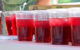 A table filled with cups filled with red drink. (Photo by Anthony Crider via Flickr/Creative Commons https://flic.kr/p/2m6ELtZ)