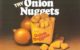 A 1970s ad says "Try Onion Nuggets." A yellow French fries-size container holds onion nuggets, with more nuggets in the foreground and several onions in the background.