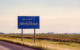 A "Welcome to North Dakota - Legendary" sign near the border with Manitoba, Canada. (Photo by Tony Webster via Flickr/Creative Commons https://flic.kr/p/2jEpUVa)