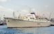 The cruise ship Oceanos leaving Piraeus Harbor on June 1986. Photo by Peter J. Fitzpatrick, CC BY-SA 4.0, via Wikicommons https://commons.wikimedia.org/w/index.php?curid=41123433 https://en.wikipedia.org/wiki/MTS_Oceanos#/media/File:"Oceanos"_-_Piraeus,_1986.jpg