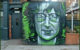 Mural of John Lennon on the side of a pub in Camden High Street, London. (Photo by Loco Steve via Flickr/Creative Commons https://flic.kr/p/AUb58E)