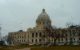 Exterior of the Minnesota state capitol building, on a cloudy day.