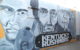 A mural shows the faces of Muhammad Ali, Abraham Lincoln, Colonel Sanders and Secretariat, with the words KENTUCKY RUSHMORE underneath.