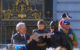 Batkid (center) receives the city from San Francisco Mayor Ed Lee while Batman and Batkid's family look on. (Photo by Shelly Prevost via Flickr/Creative Commons https://flic.kr/p/hAb5RC)