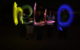 A long-exposure photo shows five people using lights to "paint" the word "hello" into the air. (Photo by ashley norquist via Flickr/Creative Commons https://flic.kr/p/79Sns6)