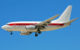 A white airplane with a red stripe and no other markings, except for the aircraft ID number. This is believed to be a "Janet" flight. (Photo by Eddie Maloney via Wikicommons/Creative Commons) https://en.wikipedia.org/wiki/Janet_(airline)#/media/File:N273RH_(4614589706).jpg