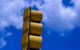 A side view of a stoplight against a bright blue sky. (Photo by Andrew Malone via Flickr/Creative Commons https://flic.kr/p/5fgVeA)