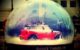 A red Mini Cooper car inside a snow globe. The base of the snow globe reads "Shake things up." (Photo by Lostinawave via Flickr/Creative Commons https://flic.kr/p/aDnyRS)