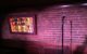 A microphone in front of a brick wall at the Comedy Cellar. (Photo by Gus Taf via Flickr/Creative Commons https://flic.kr/p/xtN7Xb)