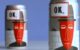 screenshot from an OK Soda ad, showing two cans of the soft drink.