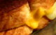 Close-up of the melty part of a grilled cheese sandwich. (Photo by Sandy Sarsfield via Flickr/Creative Commons https://flic.kr/p/M25Pji)